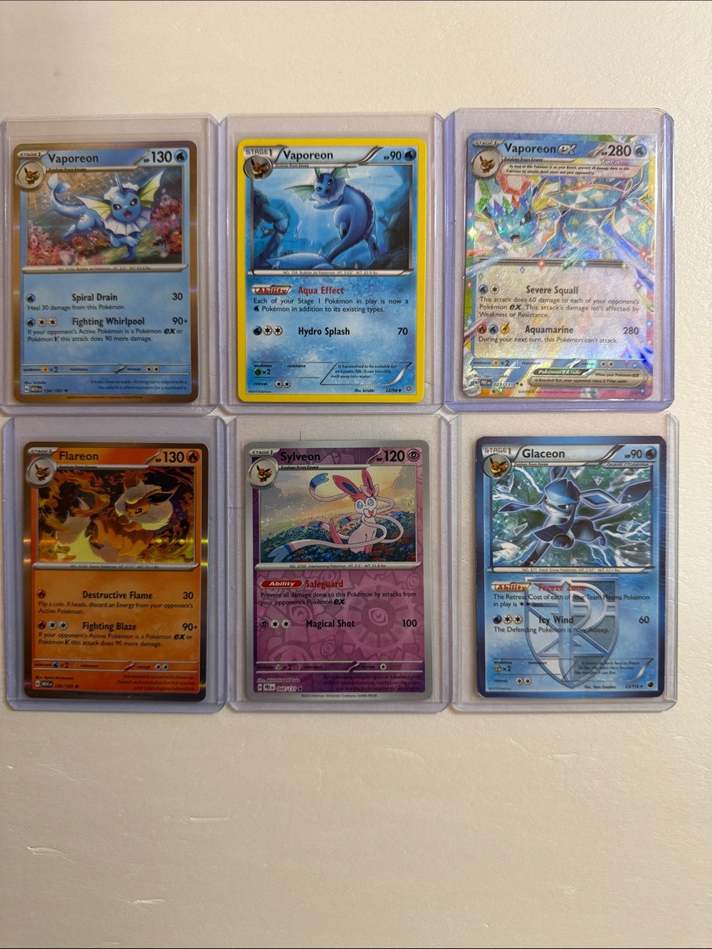 Pokemon Holo Vaporeon & Evolutions Card Lot - Blue, Purple, Orange